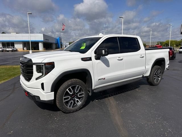 2023 GMC Sierra 1500 AT4 in Summit White — front three-quarter view
